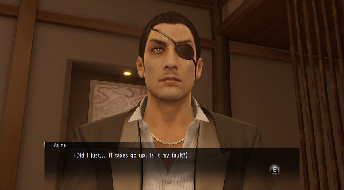 Begin image ID: An in-game screenshot of Majima Goro in Yakuza 0 Goro stares forwards as text box below him reads "[Did I just... If taxes go up, is it my fault?]" End image ID.